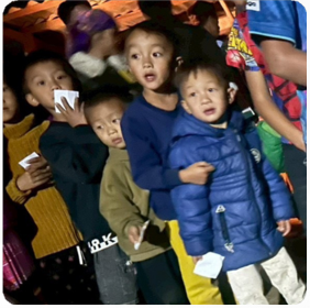 A group of children standing together

AI-generated content may be incorrect.